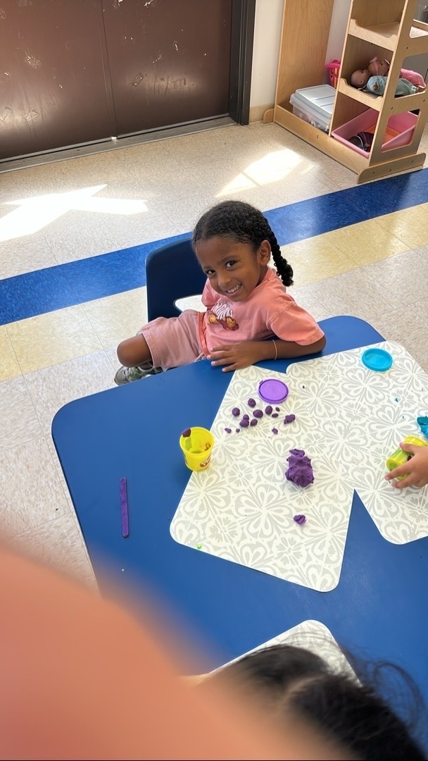 A smile and a little play dough at Kingston Academy
