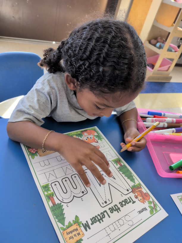 Practicing our letters at Kingston Academy