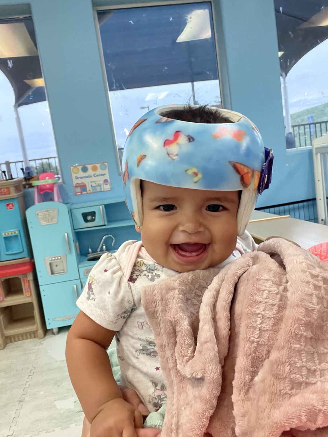 A bright baby smile at Kingston Academy