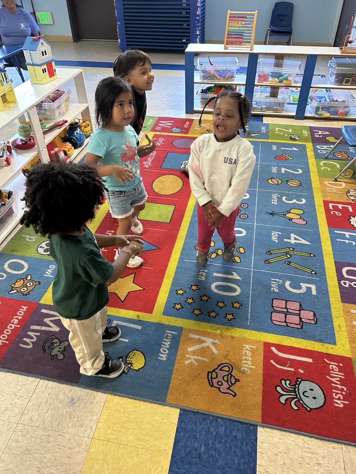 Preschool children moving and playing together